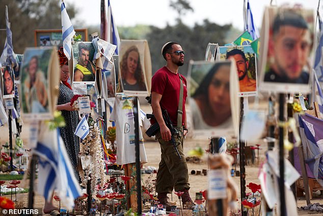 A man walks at the site of the Nova festival, where partygoers were killed and abducted during the Hamas attack on October 7