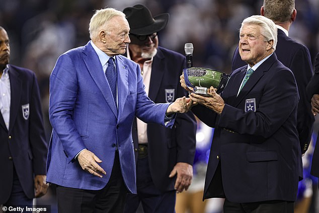 Jerry Jones embraces Jimmy Johnson during his induction into the Cowboys Ring of Honor