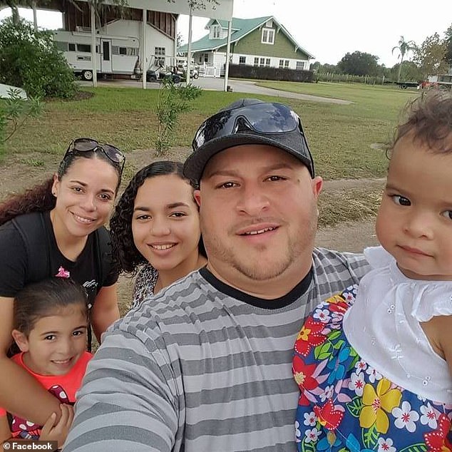 Luis Aldarondo Jr, 37, was the murdered security guard. He is pictured with his wife, young son and daughter, and another family member