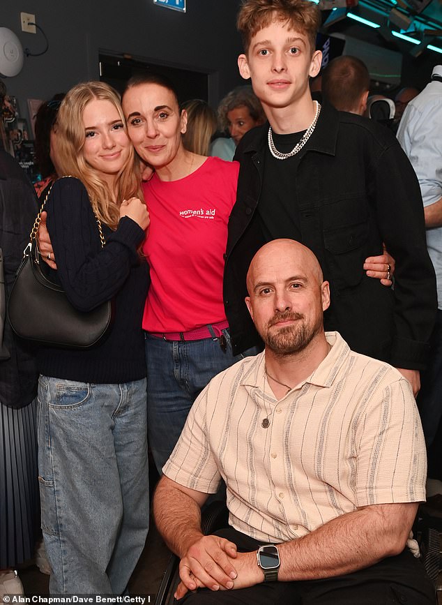 Giovanni is said to have made a rude comment about a member of Amanda's family, prompting BBC bosses to 'basically ask' her if the dancer meant the remark as a light-hearted joke (Amanda pictured with son Joe, daughter Grace and fiancé Jonathan Goodwin)