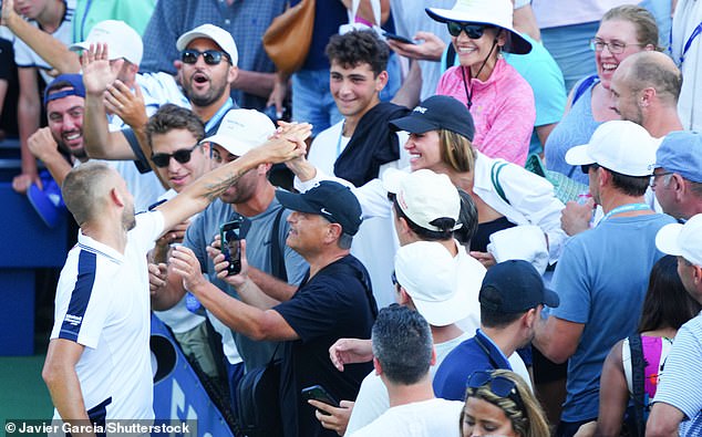 Evans reaches out to his partner Aleah in the audience after the five-hour, 35-minute epic