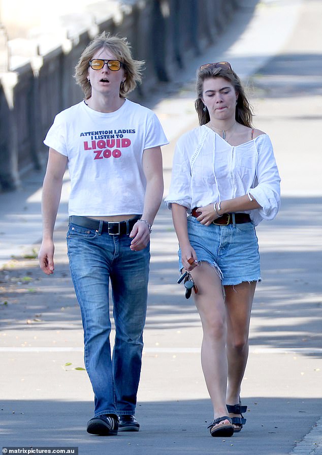 She also wore a pair of comfortable black sandals and at one point covered herself with a billowing white shirt