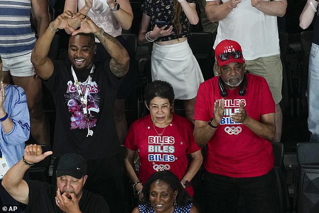 Biles' husband Jonathan Owens, mother Nellie and father Ron cheered her on in Paris