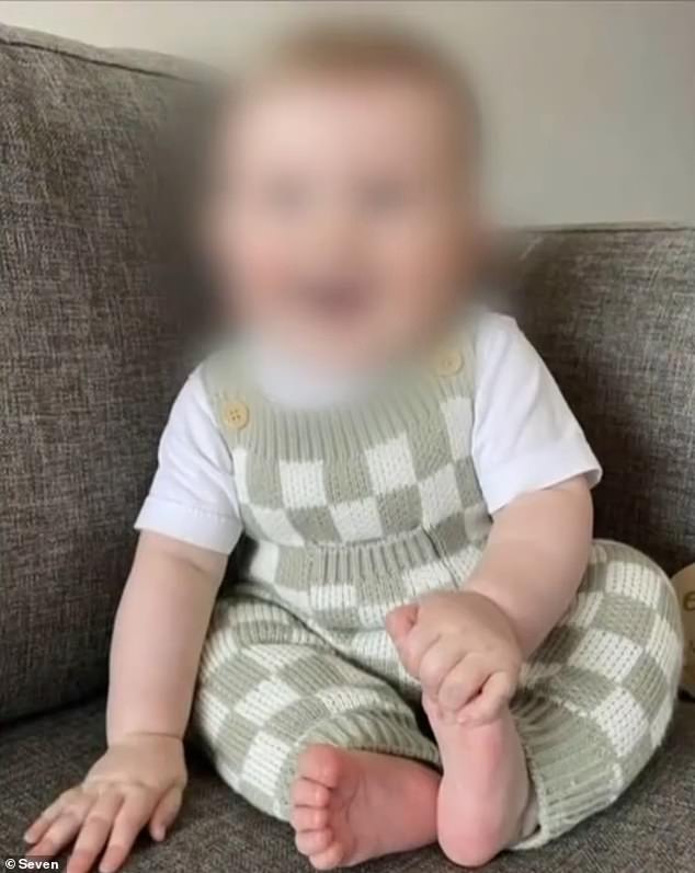 The nine-month-old boy (pictured before the attack) remains in Queensland Children's Hospital