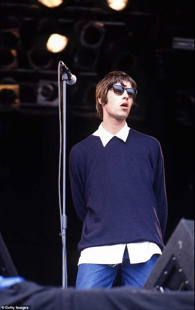 Liam Gallagher of Oasis performing on stage at Glastonbury in 1994