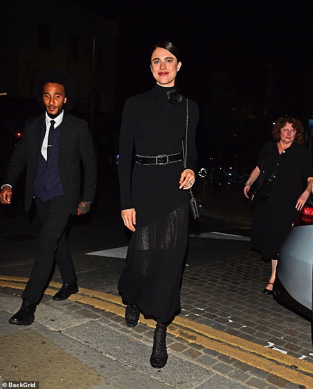 Margaret, meanwhile, kept it chic and simple in a sheer black knitted dress