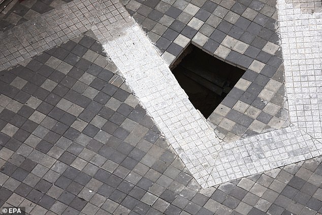 A view of a sinkhole that formed in the same area where an Indian woman fell into an eight-meter deep sinkhole