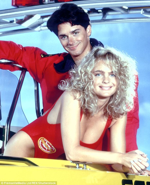 The hunk with Billy Warlock in a cast photo for the babes-on-beach show