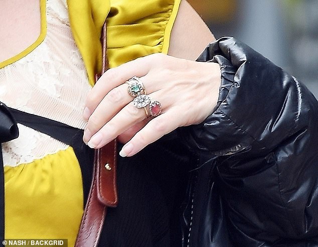 The Harry Potter star wore a long, black phone pendant and an array of large jewellery, including a diamond star on her ring finger, fuelling speculation that she and boyfriend Rye Dag Holmboe could be engaged.