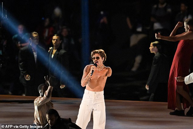 Singer Lucky Love performs at opening ceremony that surpasses that of the Olympic Games