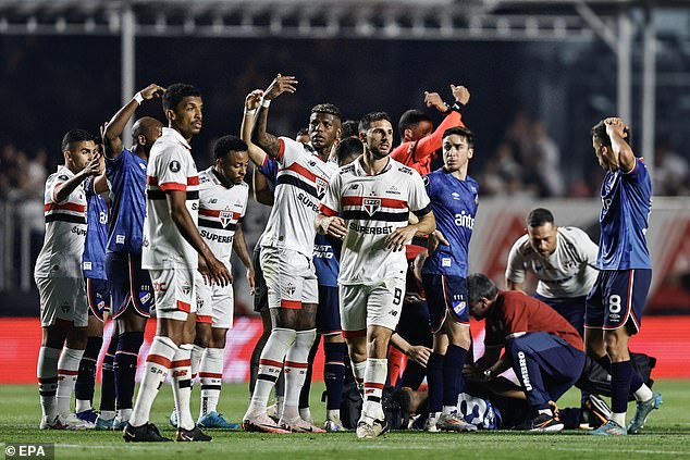 Players desperately call for medical help after Juan Izquierdo collapsed on the pitch last week