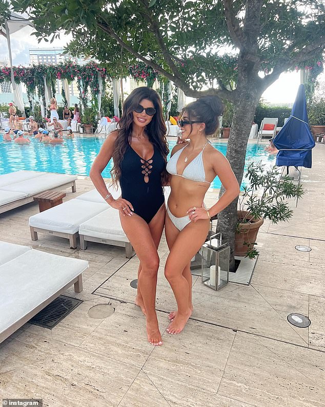 The mother-daughter duo posed in bathing suits as they enjoyed a day at a Tampa-area hotel pool