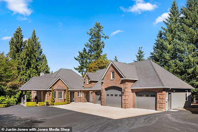 The main building has a brick exterior and an elegant, enclosed, circular driveway