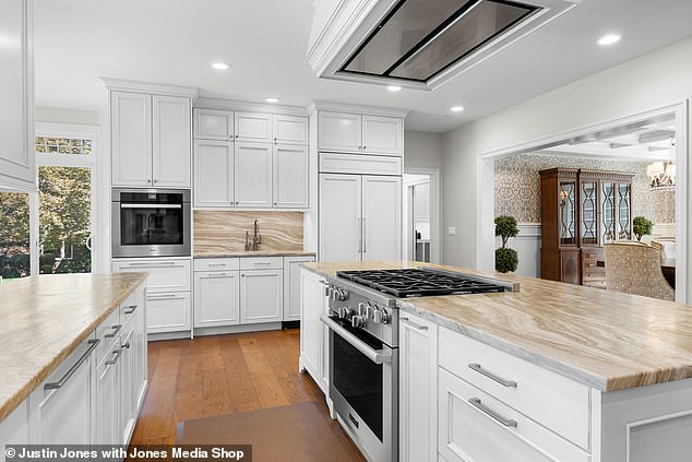 The kitchen features a six-burner stove, two dishwashers and a Sub-Zero refrigerator