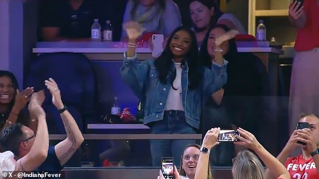 The crowd went wild when Biles' presence was announced and her face appeared on the screen