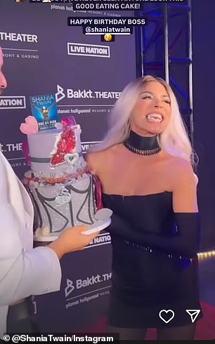 A clip showed her taking a bite out of a decorated cake during a red carpet performance