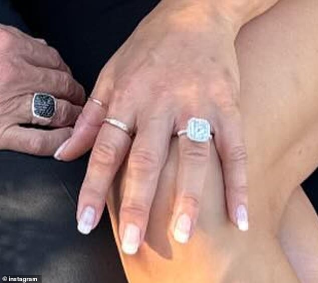 She shared a photo with John showing off her huge diamond engagement ring