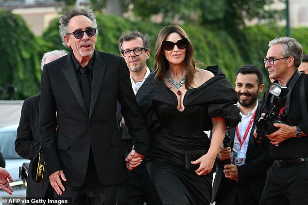 The Italian star showed off her incredible figure in the maxi dress with dramatic puff sleeves