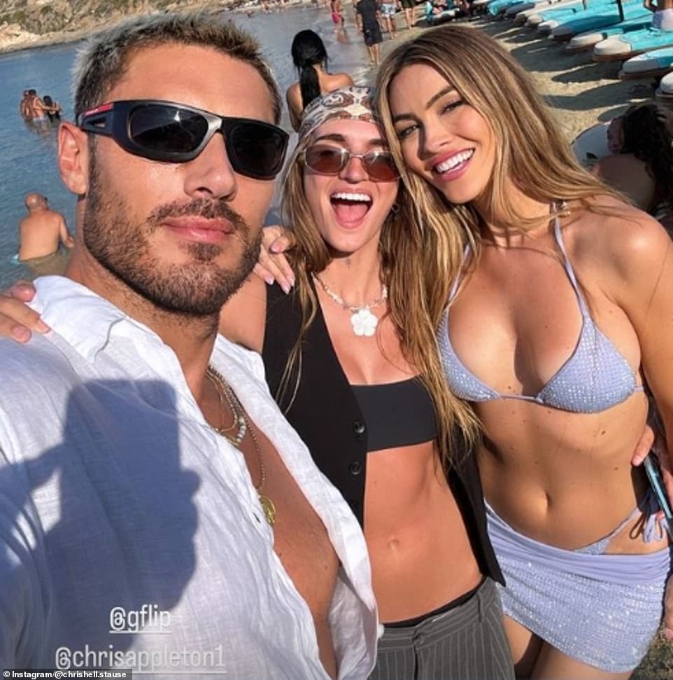 Selling Sunset star Chrishell wore a light purple shiny string bikini, while her husband wore a black bra top and tiny, low-slung panties, while she was with celebrity hairstylist Chris Appleton, who works with Kim Kardashian.