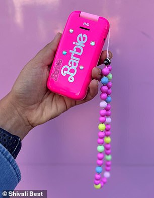 As if that wasn't jazzy enough, there's also a beaded strap adorned with Barbie phone charms and a selection of sparkly gems and vintage stickers