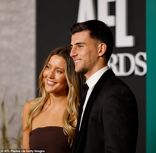 The lovebirds led the arrivals at Centrepiece with the Magpies' 21-year-old midfielder looking handsome in a monochrome suit and tie