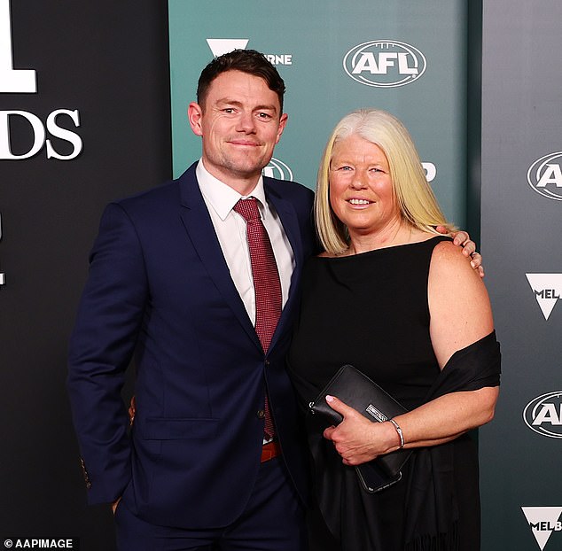 The couple also wore black, with Lachie, who is expecting his second child with wife Jules, opting for a pop of colour with a red tie