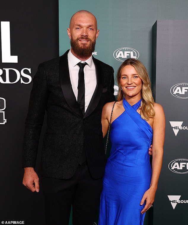 The ruckman had a big smile on his face as his partner stole the show in a royal blue halter dress