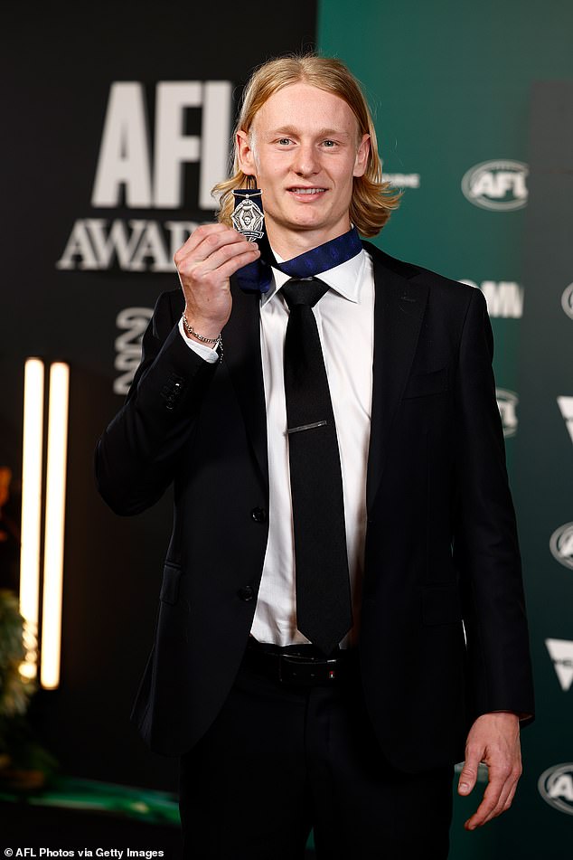 Geelong's 21-year-old Ollie Dempsey (pictured) took centre stage at the awards ceremony as he took home the AFL Rising Star Award