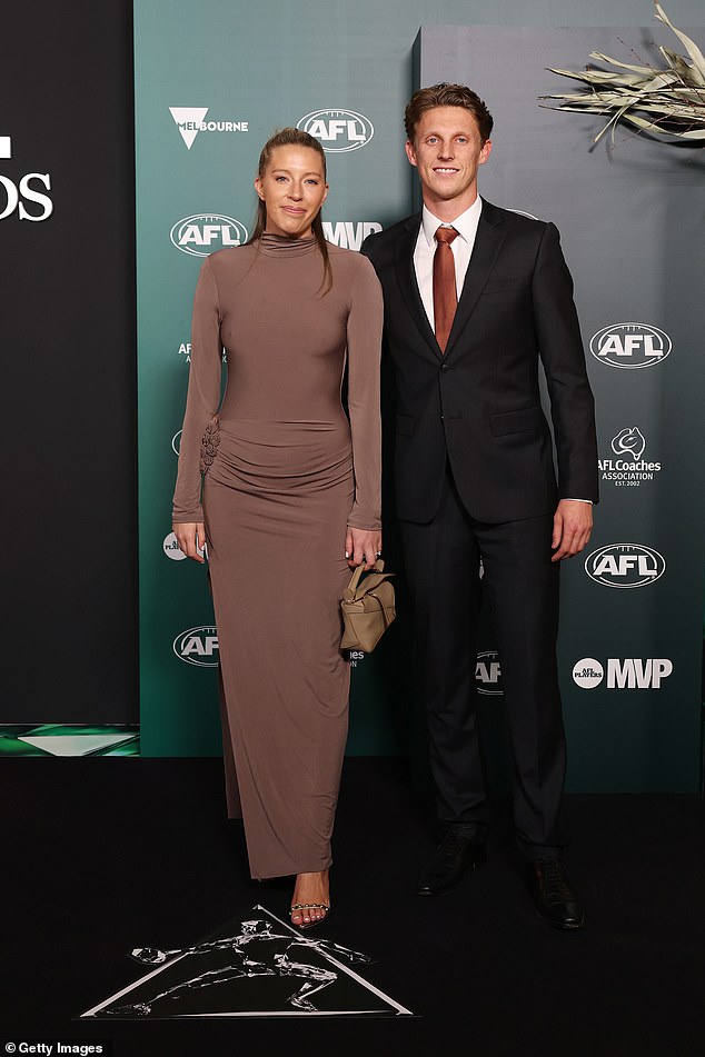 Giants player Lachie Whitfield, 30, (right) and girlfriend Adelle Beckwith (left) also made an appearance