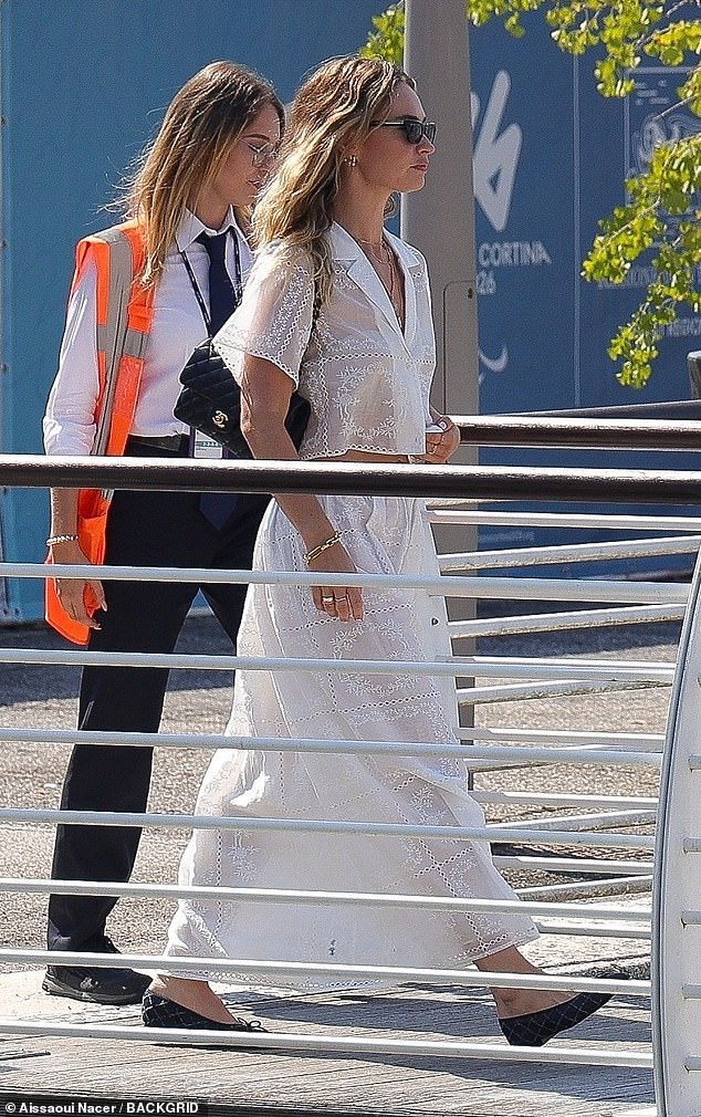 Lily looked cheerful as she walked through the airport before boarding a nearby water taxi boat