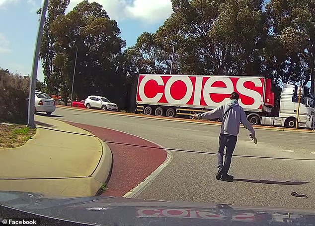 A man with a gun confronts another driver at the intersection of Pinjarra and Mandurah Roads in Mandurah on Tuesday