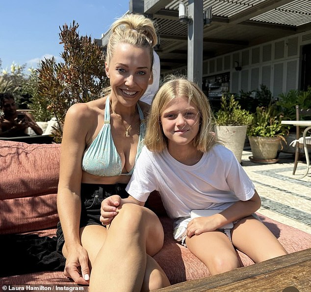 The blonde bombshell showed off her ample cleavage in a pair of black jeans as she posed with her daughter Tahlia