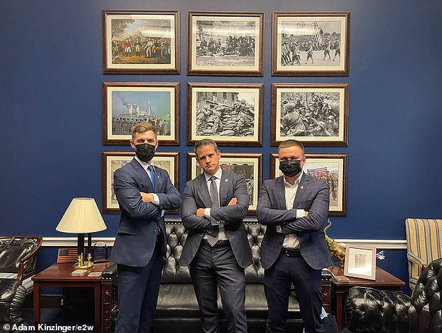 U.S. Air Force Lt. Col. and former Congressman Adam Kinzinger, center, with Ukrainian Lt. Col. Oleksii Mes, 31, right