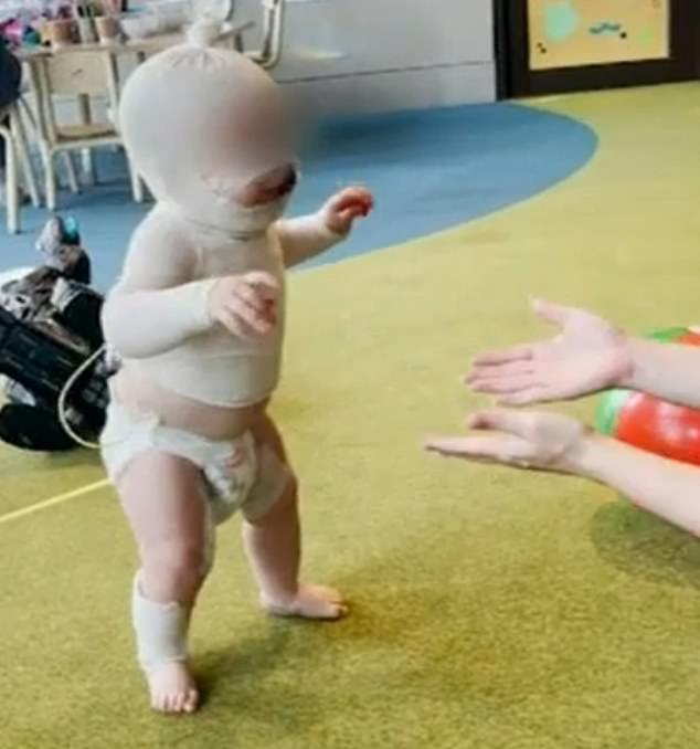 In a positive sign of recovery, Luka's mother shared a video of the baby, showing him walking (pictured) and smiling for the first time since Thursday's attack