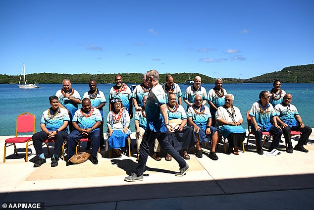 Mr Albanese was caught on camera arriving late for the traditional leaders' photo taken on the last day of the Pacific Islands Forum annual meeting (see photo)