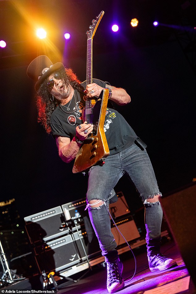 The Paradise City musician completed his ensemble with sunglasses, chains and Converse shoes as he took to the venue's stage