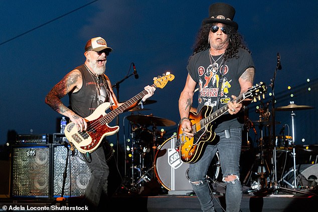 Slash was seen on stage in Gotham with musician Johnny Griparic