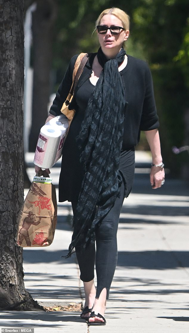 Alice Evans goes grocery shopping in Los Angeles this week with one of her daughters