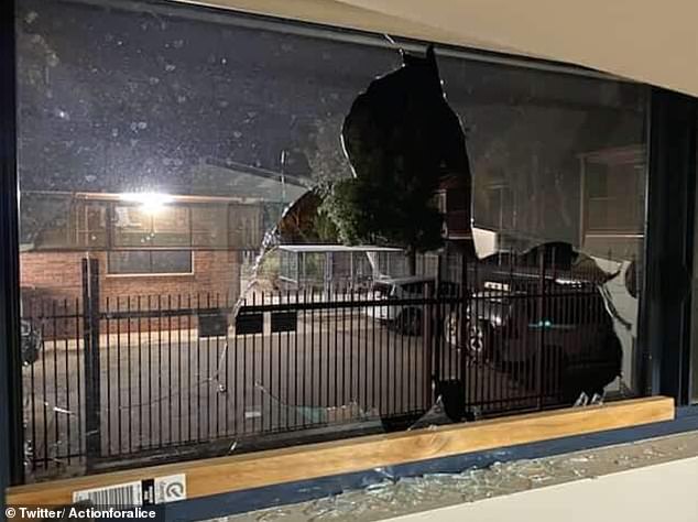 A broken window of the house in Alice Springs where huge rocks were thrown through the glass