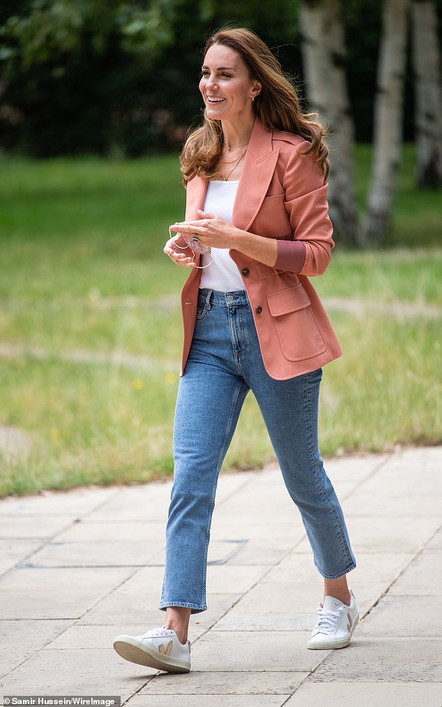 Kate wears the same sneaker, with a gold V, while walking around London in 2022