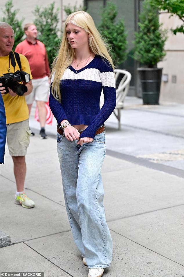 Her youngest daughter Cosima, 14, also joined in, dressed in a navy sweater, jeans and sneakers