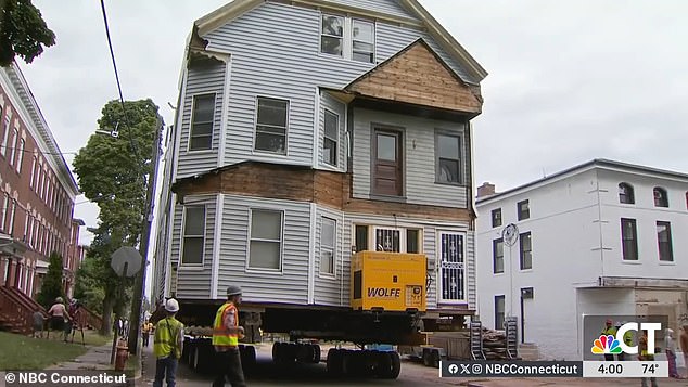 The houses were lifted from their foundations and moved intact to their new locations in the city