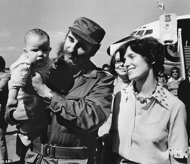 Margaret Trudeau smiles as Cuban President Fidel Castro holds her youngest son Michel after the Trudeaus arrive in Havana, Cuba in 1976