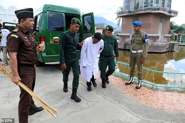 The victims are led out of prison vans to receive their sentences on August 30, 2024