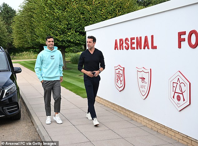 Merino (left) is shown around Arsenal's training ground by technical director Edu