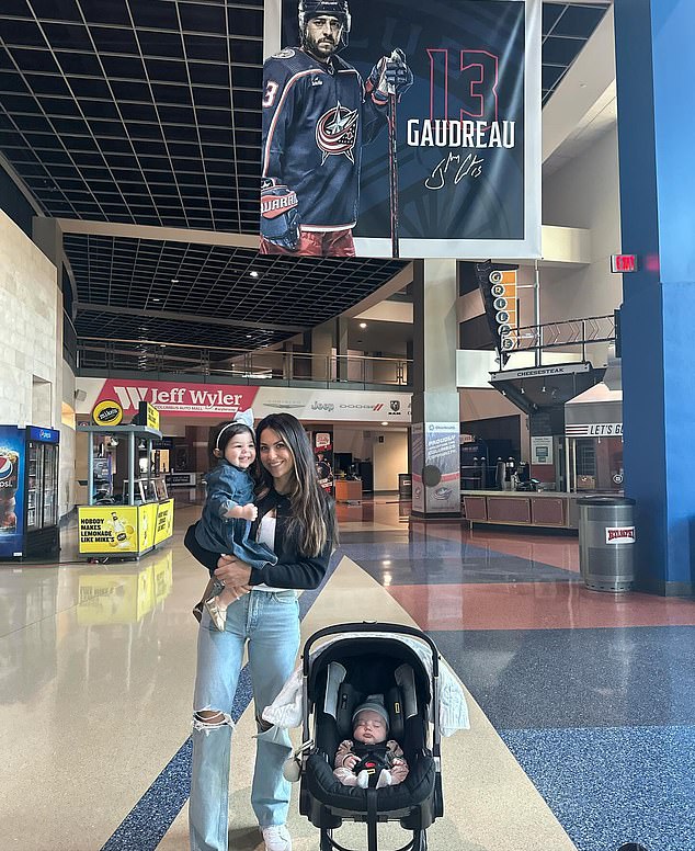 Meredith also stood under a banner with a picture of Johnny in the hockey arena