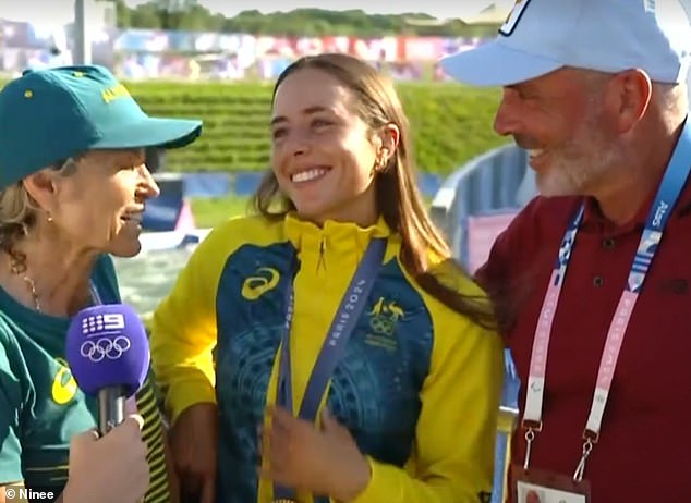 Proud parents Myriam Fox-Jerusalmi and Richard Fox are pictured celebrating with Noemie after her stunning kayak cross victory in Paris