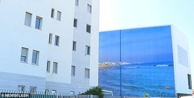 The photo shows the giant canvas that replaces the sea view in Torrevieja, Spain