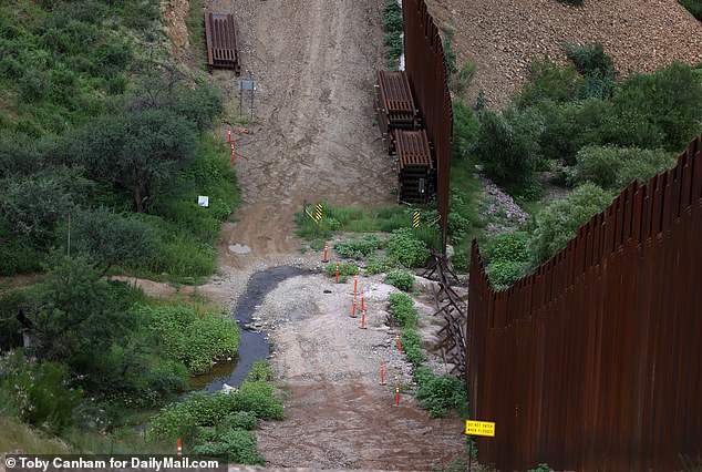 There were sections along the border that appeared to be completely missing. Migrants were seen entering the US at the location pictured here