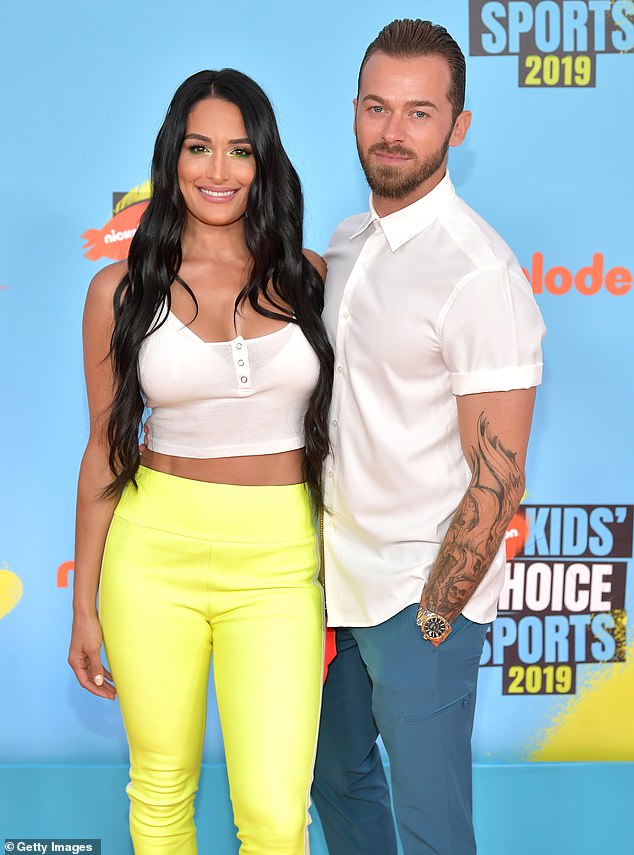 According to a radio report obtained by TMZ on Friday, Artem called 911 to request medical attention, but he also claimed Nikki threw shoes at him during the alleged incident; seen in Santa Monica in 2019